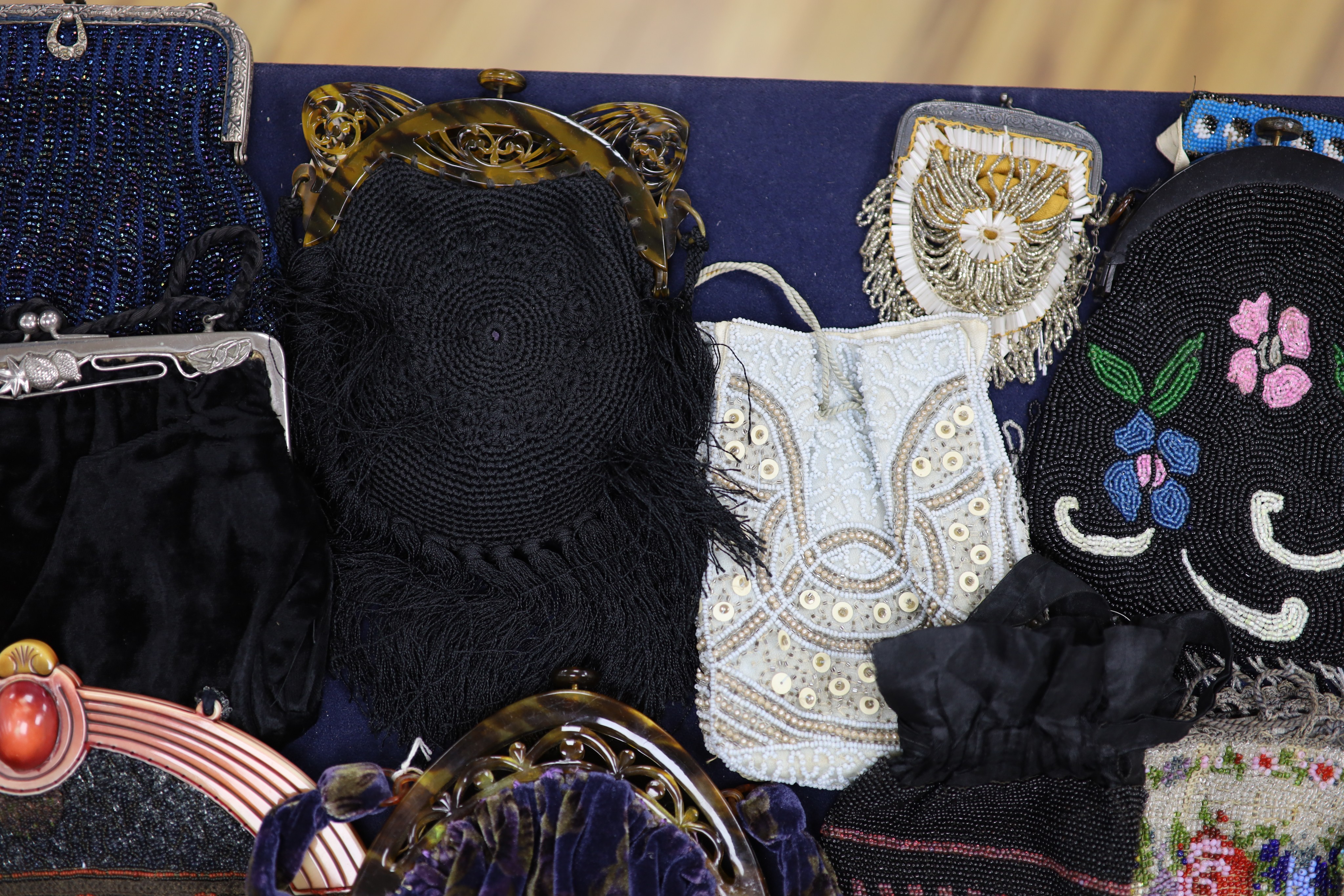 A collection of approximately fifty Victorian and later beadwork, white metal and fabric purses etc.